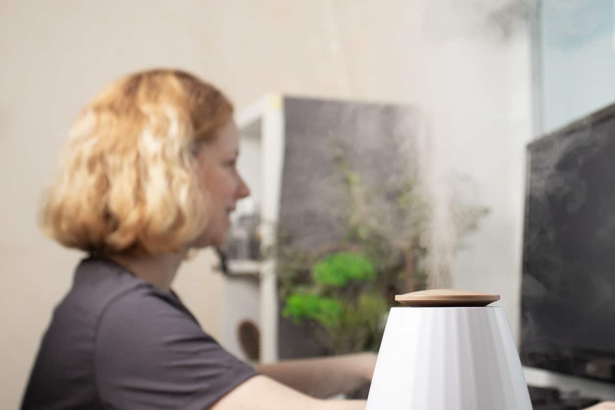 Woman using a humidifier to help her ENT health