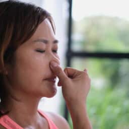 Woman breathing through her nose