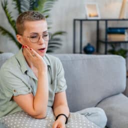 Woman Having Toothache At Home