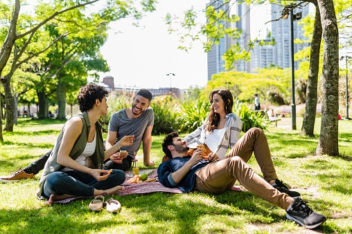 Friends at picnic on a sunny afternoon.